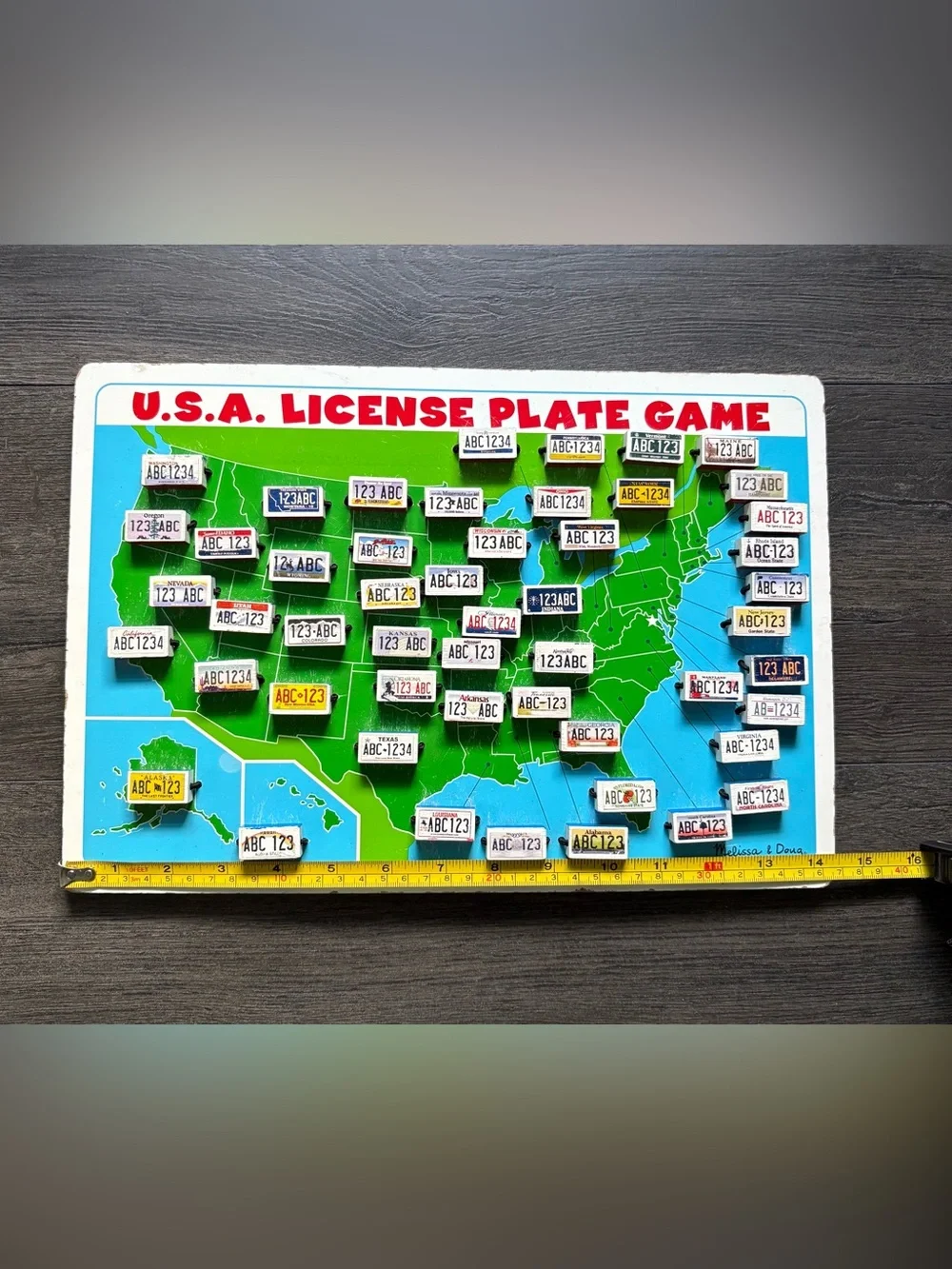 Melissa & Doug Wooden USA License Plate Car Travel Flip Game 14.5 x10 Inch Board